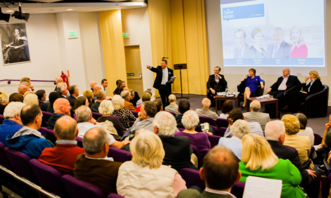 A full house turned out at the AK Bell Library Theatre to debate the big issues concerning the Fair City.