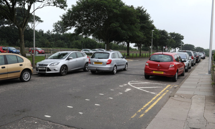 Parked cars cause congestion on the road, despite the provision of a car park opposite Arbroath Infirmary.