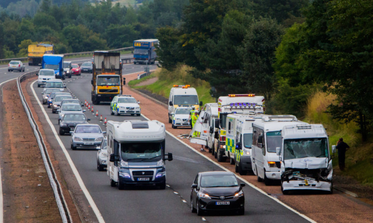 The damaged vehicles at the side of road near the Broxden roundabout.