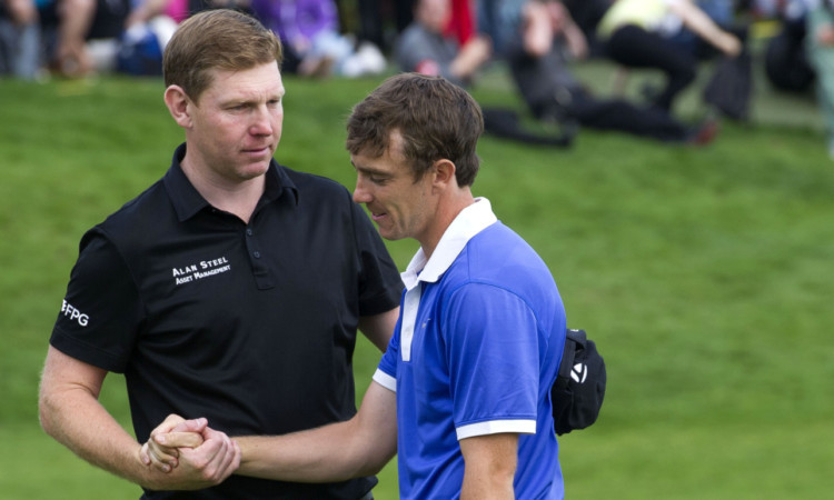 Tommy Fleetwood (right) shakes hands with runner-up Stephen Gallacher.