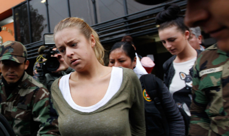 Police escort Melissa Reid, front, and Michaella McCollum, behind right, to court.