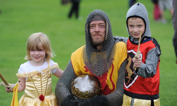 From left: Bronwyn Stenhouse, Lars Cook from Perth, who had the part of Robert the Bruce, and Maarken Stenhouse at the festival.