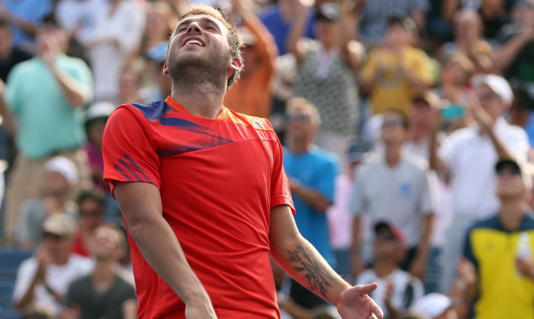 Dan Evans savours the moment after clinching victory.