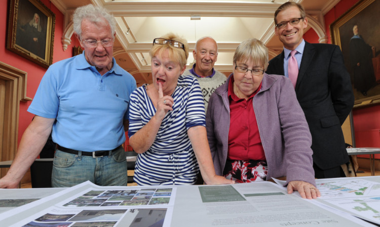 George Mitchell, Jean Clark, Ian McHardy and Joy Mowatt examining the plans with project manager Mark Richardson.