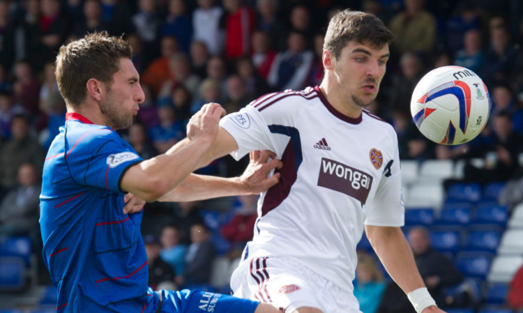 Inverness defender Graeme Shinnie battles for the ball with Callum Paterson.