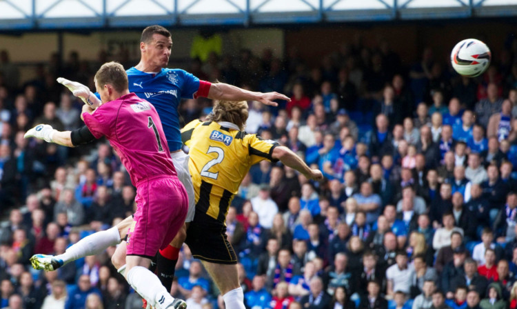 Lee McCulloch gets up highest to head in the second goal of his hat-trick.