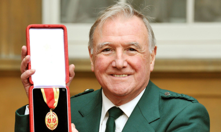 Sir Malcolm Bruce holds his insignia of Knighthood, which was awarded to him in November last year.