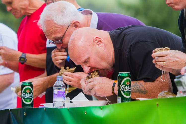 Birnam hailed a conquering hero at the weekend as a young man from the borders secured the title of World Haggis Eating Champion for a third consecutive year. Lee Goodfellow from Earlston scoffed a full 1lb pudding in little more than two and a half minutes in front of an impressed audience. Far from the stereotypical eating challenge competitor, Lee was also a competing runner at the annual event, which took place in bright sunshine. Laughs came from the participation of a pair of childrens TV presenters from Australia, who were in Scotland to film a new episode of their show Wacky World Beaters. Neither Amos Gill (aka Gilly) nor Amberley Lobo appeared too enamoured of their first taste of haggis, while Amberleys attempt to dull the flavour with mouthwash and toothpaste clearly failed. To groans from the crowd, she was the first to reacquaint herself with the small amount of haggis she had managed to pack away.