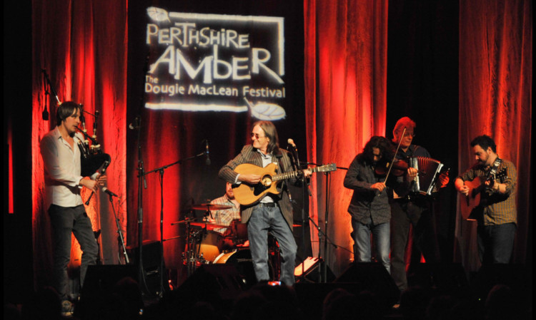 Dougie MacLean and fellow musicians on stage during last years festival.