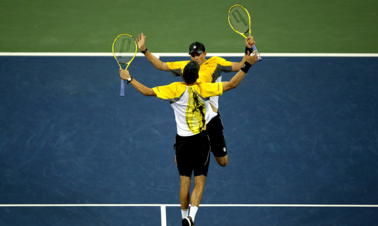 Mike and Bob Bryan celebrate match point against Colin Fleming and Jonathan Marray.