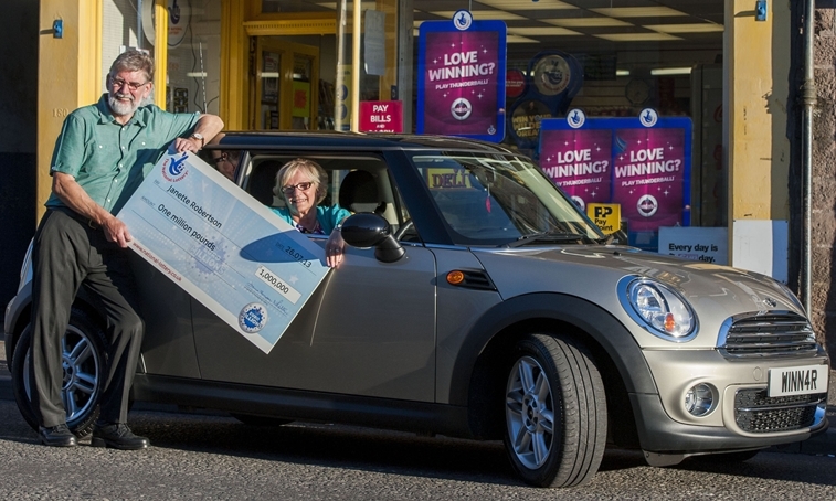 Undated handout photo issued by Camelot of EuroMillions Millionaire Raffle winners Janette Roberson and her husband Dennis from Forfar in Scotland celebrating their win with a new car. PRESS ASSOCIATION Photo. Issue date: Tuesday September 3, 2013. See PA story SCOTLAND Lottery. Photo credit should read: Alan Richardson/Camelot/PA Wire NOTE TO EDITORS: This handout photo may only be used in for editorial reporting purposes for the contemporaneous illustration of events, things or the people in the image or facts mentioned in the caption. Reuse of the picture may require further permission from the copyright holder.