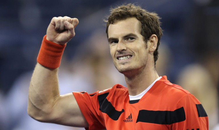 Andy Murray celebrates moving one step closer to retaining his title.