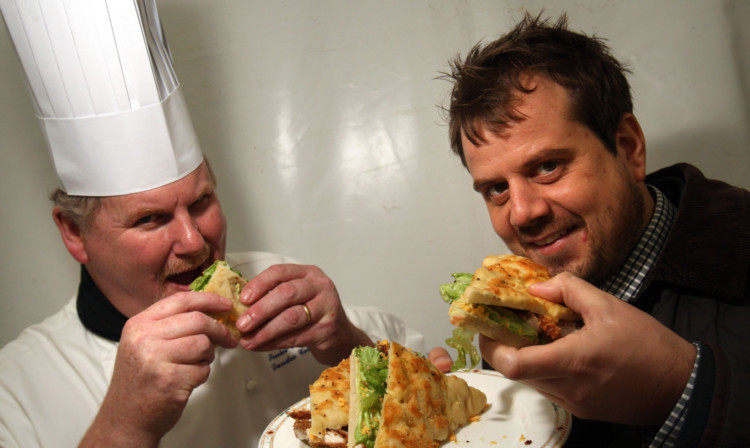 Russell Walker (Dundee College) and Cllr Craig Melville judging the school childrens sandwiches.