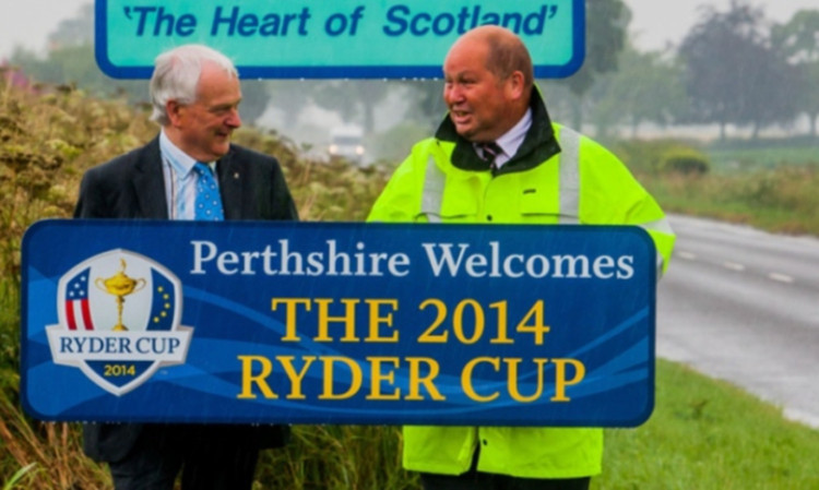 Perth and Kinross Council leader Ian Miller and Charles Haggart, roads service manager, with one of the Ryder Cup signs.