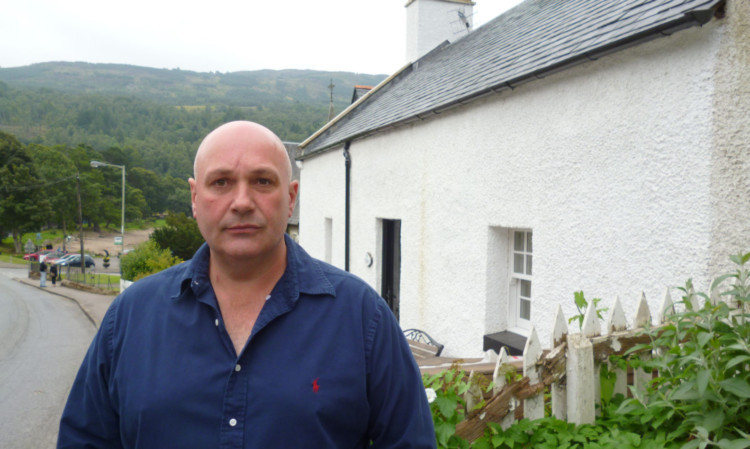 Mark Stewart at his cottage in Kenmore.