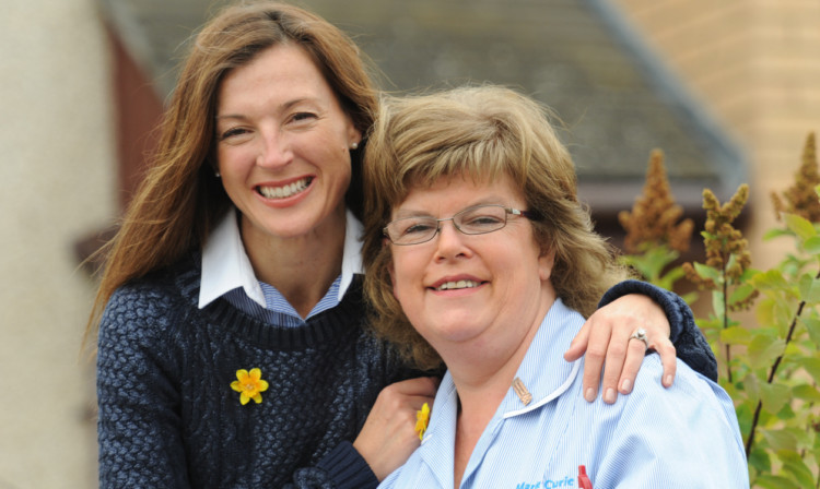 Petra McMillan, left, presented the cheque to Jane McGowan, senior health care assistant with Marie Curie Cancer Care.