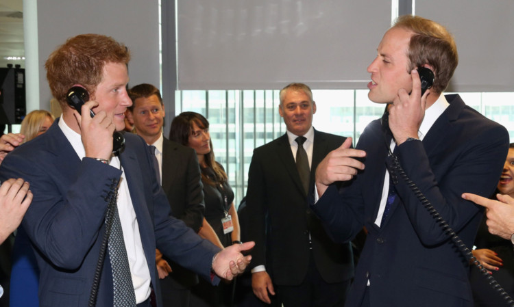Prince William and Prince Harry take part in a trade on at the BGC Partners trading floor during the BGC Charity Day 2013 at Canary Wharf.