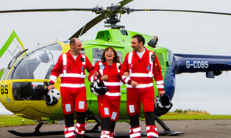 Lorraine Kelly visits Scotlands Charity Air Ambulance at Perth Airport with paramedics Bruce Rumgay and Alex Holden.