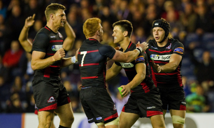 Nikki Walker (left), Roddy Grant (2nd left) and Hamish Watson (right) congratulate Harry Leonard after he scores his penalty for Edinburgh to win with the last kick off the ball.