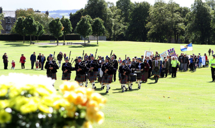 The parade makes its way into the park.