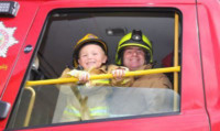 Graeme McKenzie, 3, and his grandad Archie Dick during their visit to Arbroath fire station.