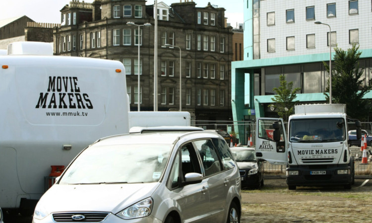 Film-crew trailers parked at City Quay in Dundee.