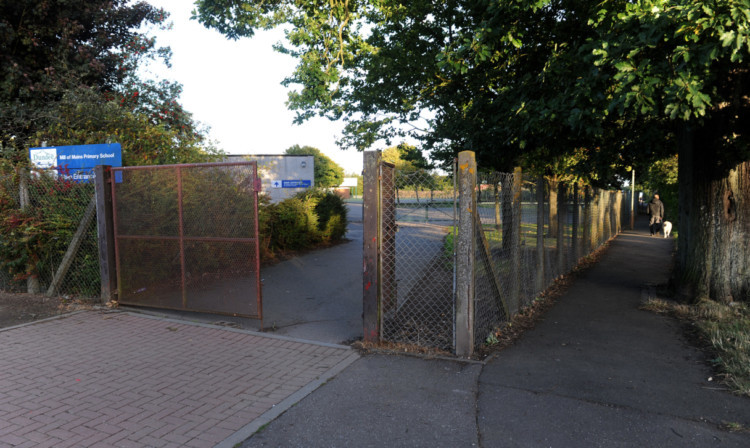 The cat was reportedly seen on the path (right) outside the school.