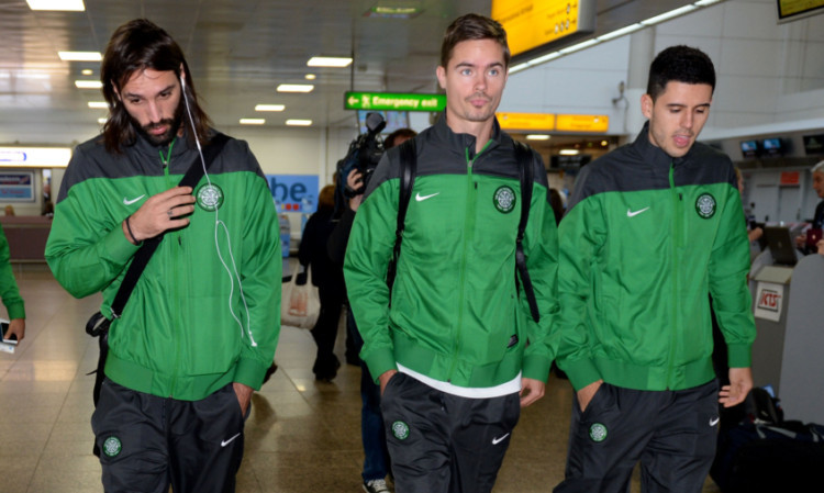 Georgios Samaras, left, Mikael Lustig and Tom Rogic check-in at Glasgow Airport as Celtic open their UEFA Champions League campaign against AC Milan.