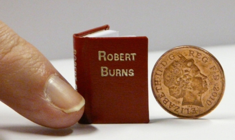 A miniature book of Robert Burns poems will be on display at the National Library of Scotland.