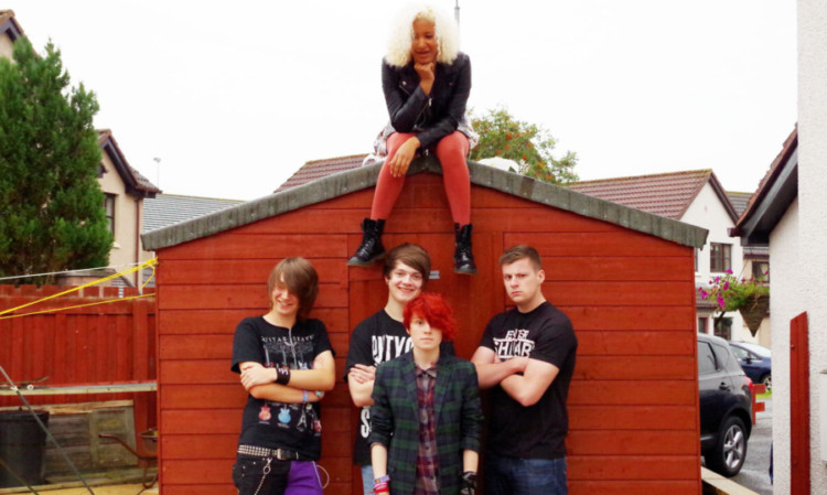 Twin Paradox: Aletha Monaghan, on top of the shed, with, from left, Robert Anderson, Austen Cook, Rowan Knox and Jack Richard.