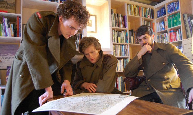 Members of the cast of Perth Theatres production of Macbeth, Andrew Barrett, Daniel Cahill and Lorn Macdonald, study maps of Scotland at the Royal Scottish Geographical Societys Fair Maids House.