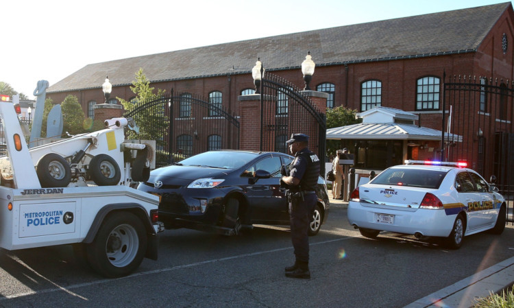 A blue Toyota Prius is towed away by Metro Police from the Washington Navy Yard.