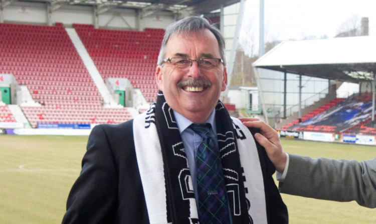 Former Dunfermline chairman Bob Garmory is all smiles at East End Park.