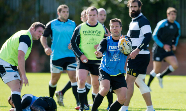Glasgow Warriors' Chris Cusiter gets on the ball at training.