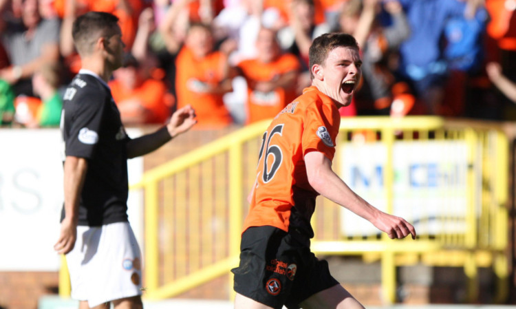 Andrew Robertson celebrates opening his account for United.