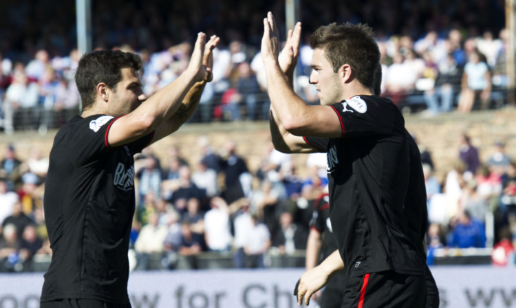 Andrew Little (right) high fives with Richard Foster after giving Rangers the lead two minutes before half-time.