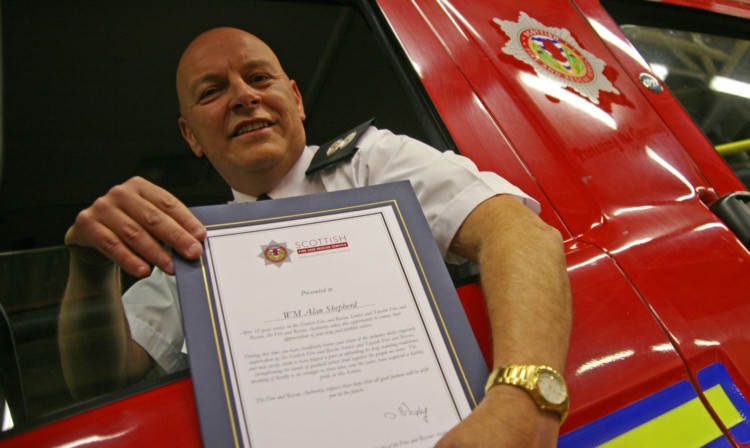 Alan Shepherd with his long-service certificate.