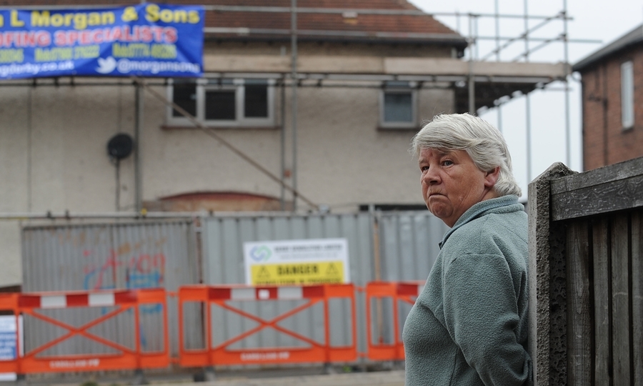 Vera Duffy, mother of Mairead Philpott, looks on as the house  in Allenton, Derby, where six children died in a fire set by Mick and Mairead Philpott is prepared for demolition. PRESS ASSOCIATION Photo. Picture date: Monday September 23, 2013. The Philpotts were jailed in April, along with friend Paul Mosley, after being convicted of killing the couple's six children by setting fire to the three-bedroom semi-detached house. See PA story FIRE Children. Photo credit should read: Joe Giddens/PA Wire