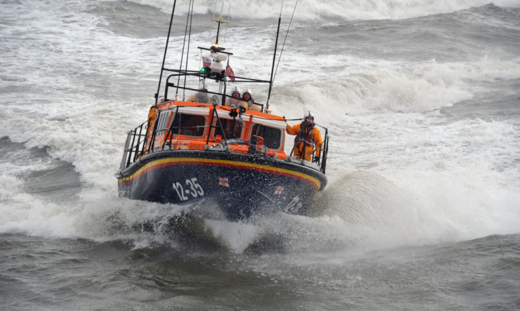 Photo shows an all-weather lifeboat in high seas.