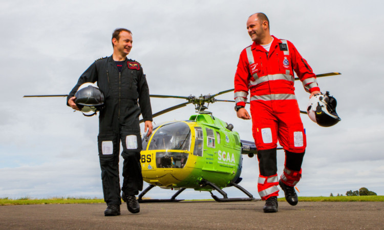 Scotlands Charity Air Ambulance pilot John Stupart, left and paramedic Bruce Rumgay.