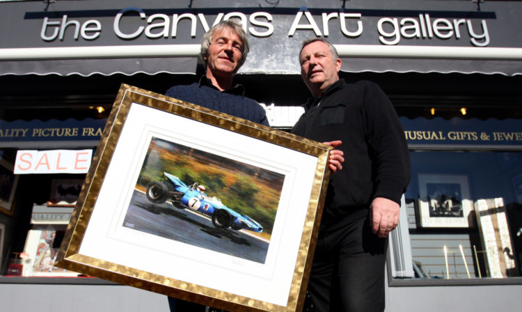 Artist Jonathan Mitchell and gallery owner John Richardson with one of the prints.