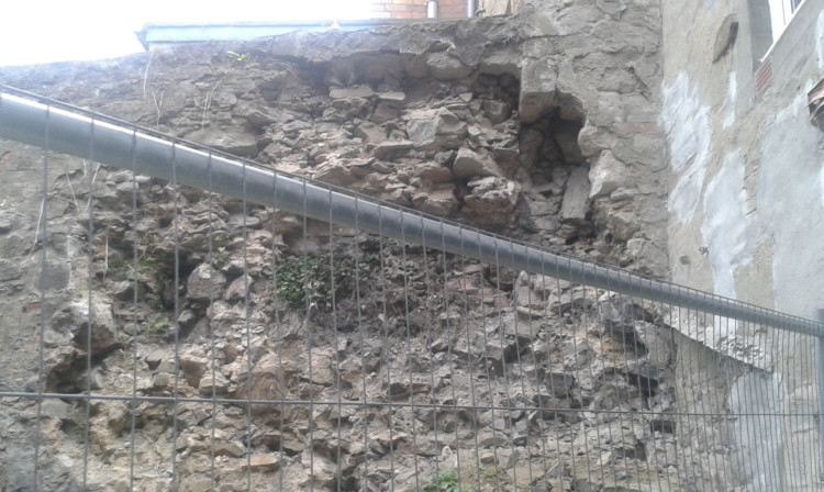 Part of the crumbling support wall at East Bridge Street.