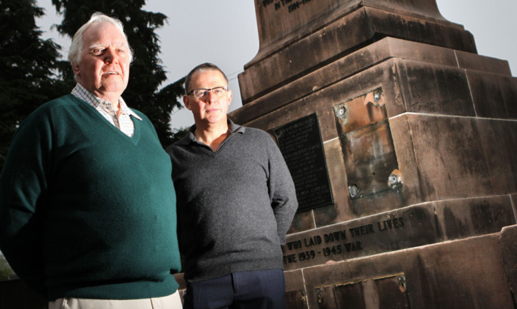 Milnathort in Bloom chairman David Henry and secretary Graeme Stewart standing beside the memorial.