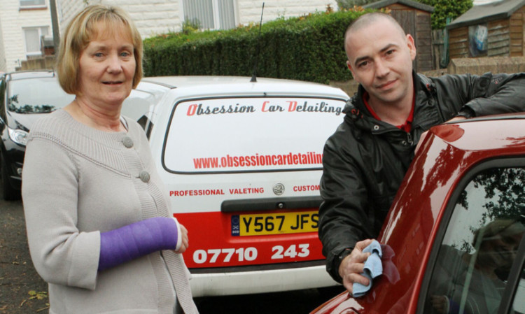 Thomas Magill finishing off Helen Anderson's car.