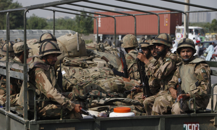 Pakistan Army troops leave to an earthquake-affected area in the Baluchistan province from Karachi.