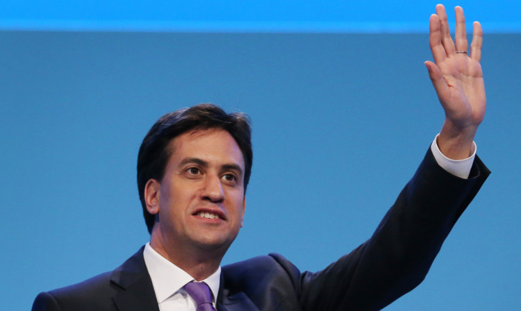 Ed Miliband waves during a question and answer session at the Labour Party conference in Brighton.