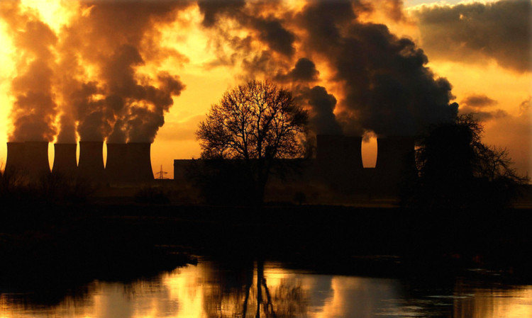 Low winter sunshine highlights the volume of emissions from Drax Power Station near Selby, Yorkshire.