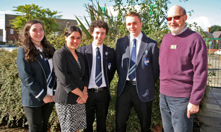 Ms Storelli-Castro and Mr Shearer with senior pupils, from left, Rowan Corrigan, Cameron Legge and David Barr.