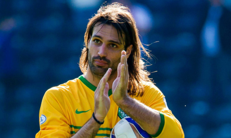 Georgios Samaras claims with the match ball.