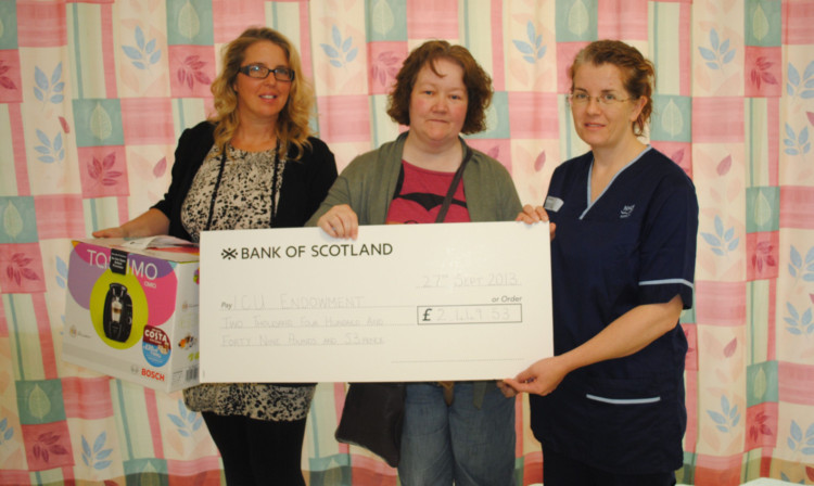 At the cheque presentation were, from left, Ryans aunt Lisa Brown, mum Jacquie Simpson and specialist charge nurse at Ninewells Aline Ramsay.